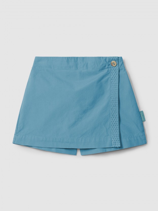 Saia-calção em sarja com detalhe de fita decorativa